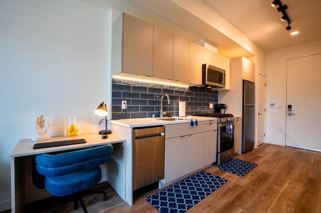 a kitchen with a counter top and a sink