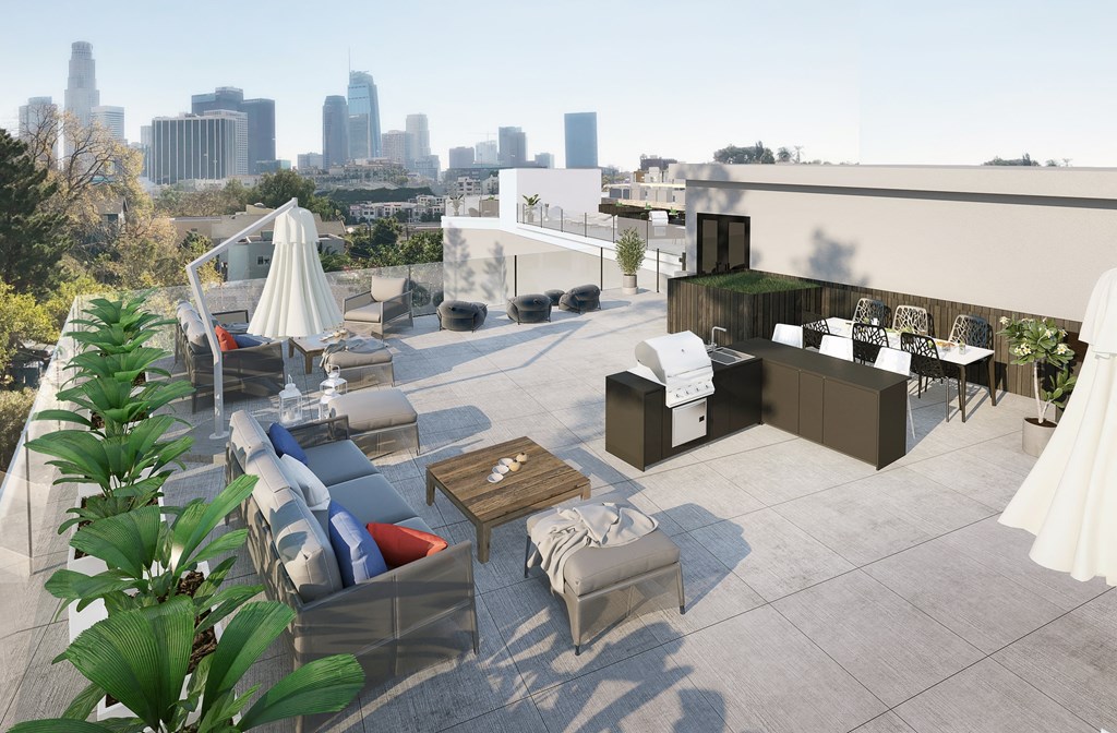 a rendering of a roof terrace with furniture and a city in the background