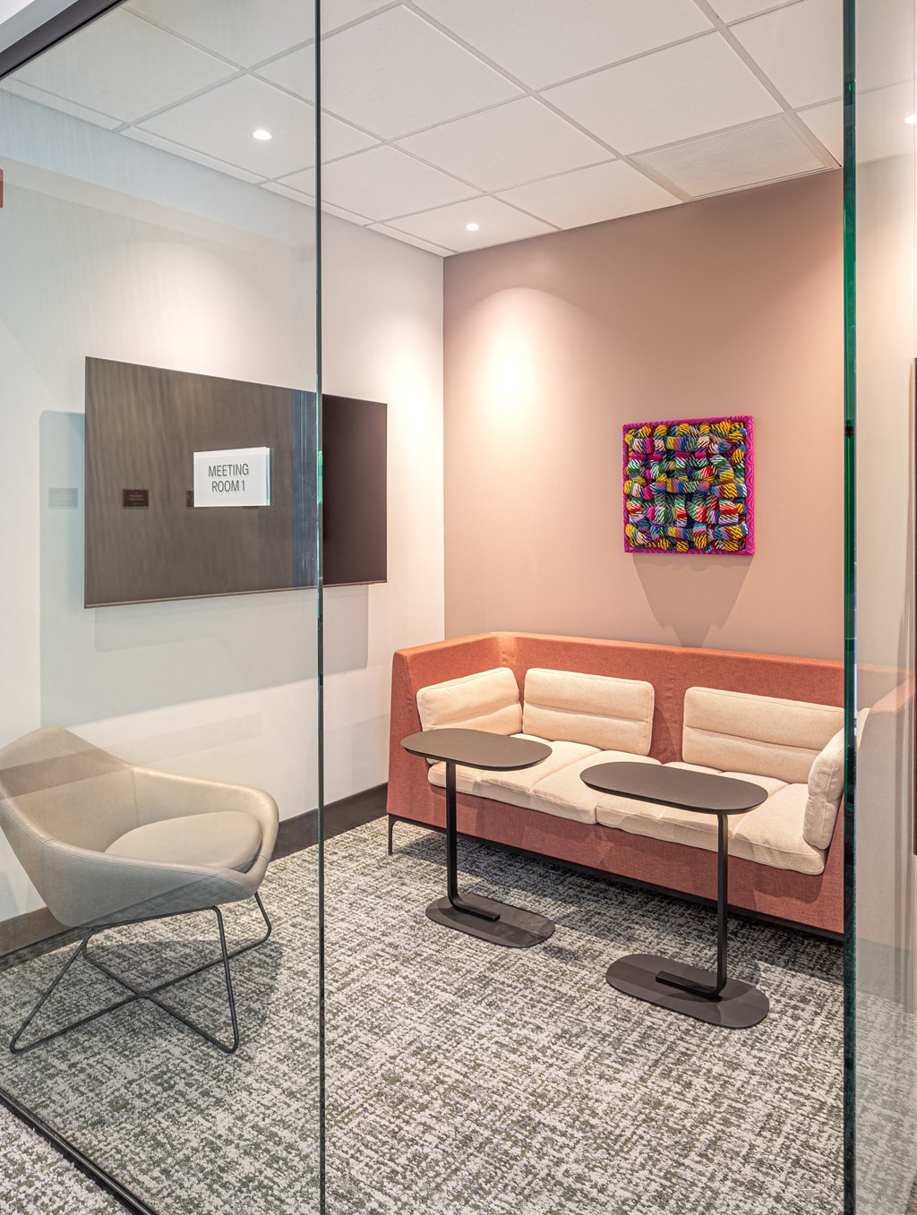 a living room with couches and chairs and a television  at Inspire West Town, CHICAGO, 60642