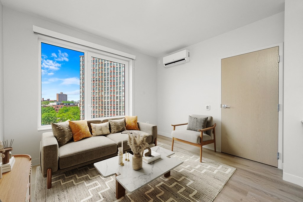 a living room with a couch and a coffee table at Inspire West Town, Illinois