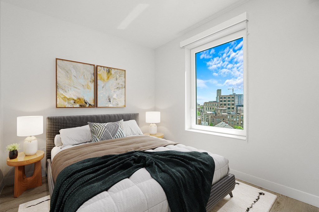 a bedroom with a bed and a large window at Inspire West Town, CHICAGO, Illinois