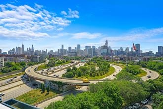 an aerial view of Chicago with the city skyline in the background at Inspire West Town, Chicago, Illinois
