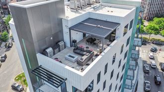 an aerial view of a large white building with a rooftop patio at Inspire West Town, Chicago, Illinois