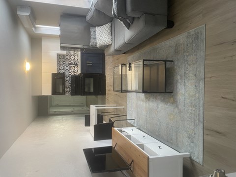 A living room with a grey couch and a coffee table.