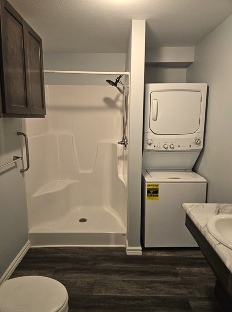 A small bathroom with a toilet, sink, and bathtub.