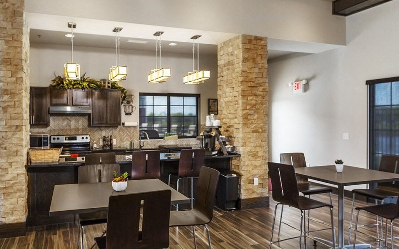 a kitchen and dining room with a table and chairs