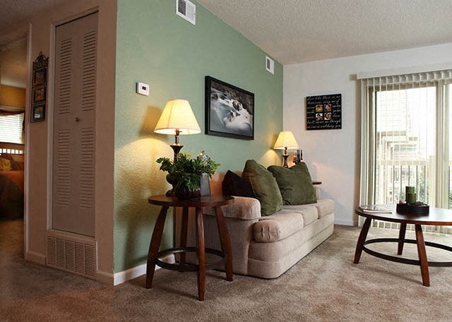 a living room with a couch and a table