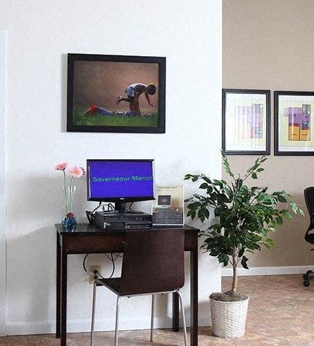 a desk with a computer and a monitor on it