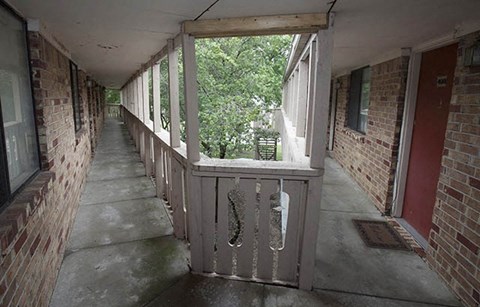 a hallway with a large window on the side of a building