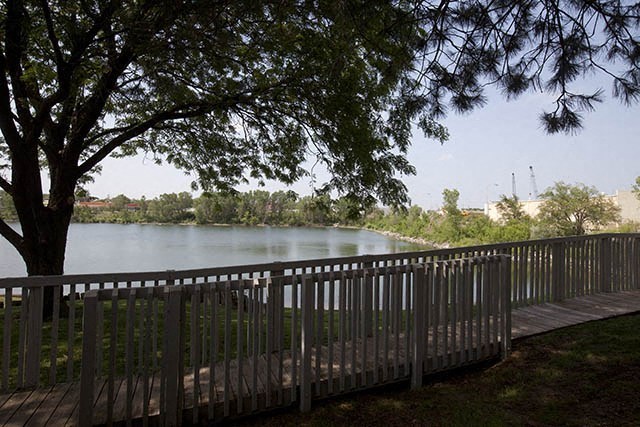 a wooden deck next to a body of water