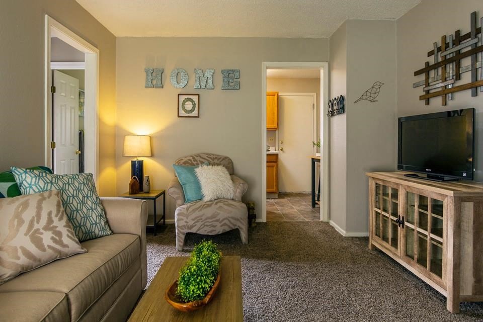 a living room with a couch and a television