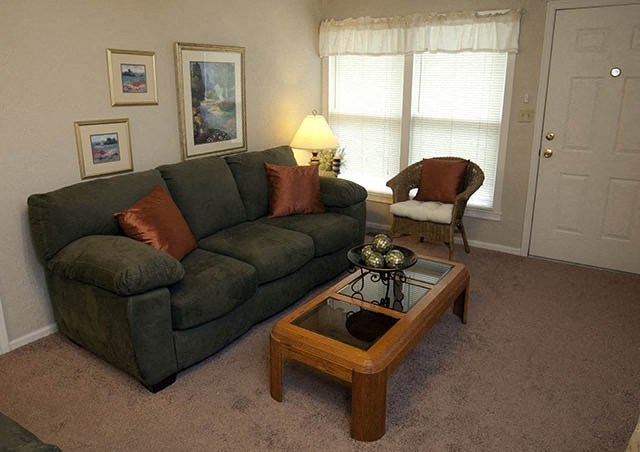 a living room with a couch and a coffee table