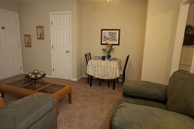 a living room with a table and a couch