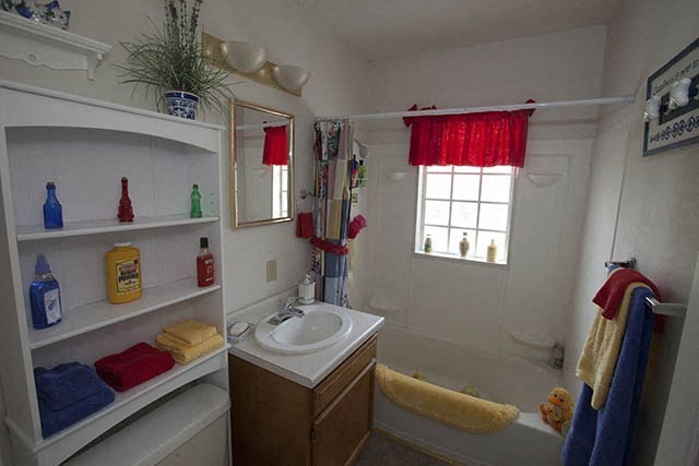 a bathroom with a sink and a bath tub