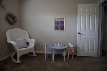 a living room with two chairs and a small table