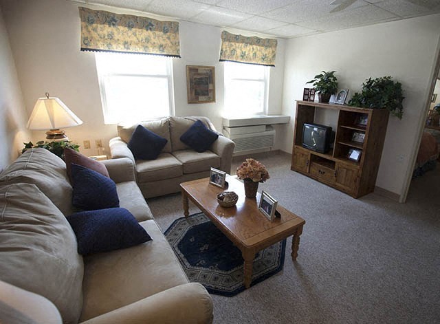 a living room with couches and a coffee table