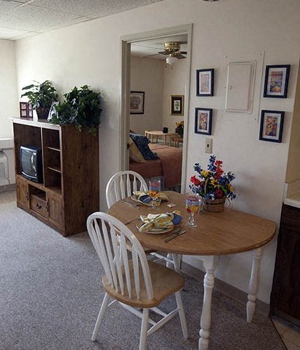 a dining room table and chairs in a living room