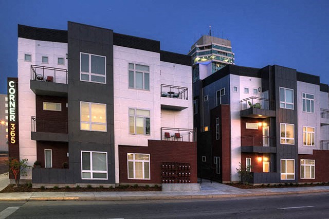 a row of buildings with a street in front of them