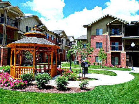 a gazebo in the middle of an apartment complex