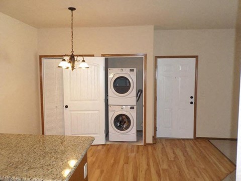 a kitchen with a washer and a dryer in it