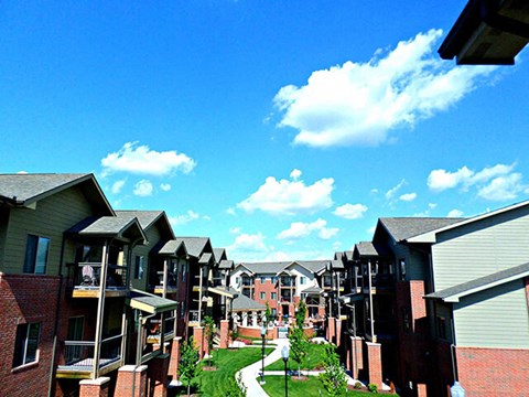 a row of houses with a pathway between them