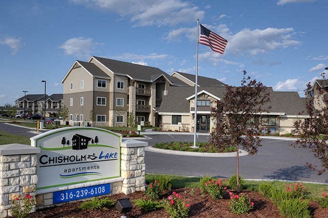 an flag flying in front of an apartment building