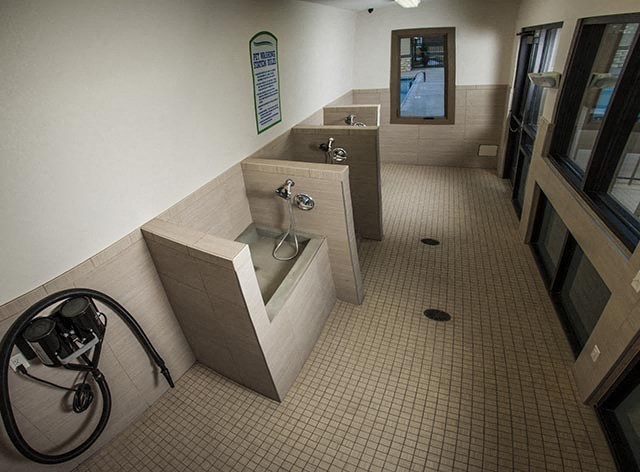 a public bathroom with two sinks and two urinals
