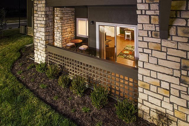 a house with a large window and a garden