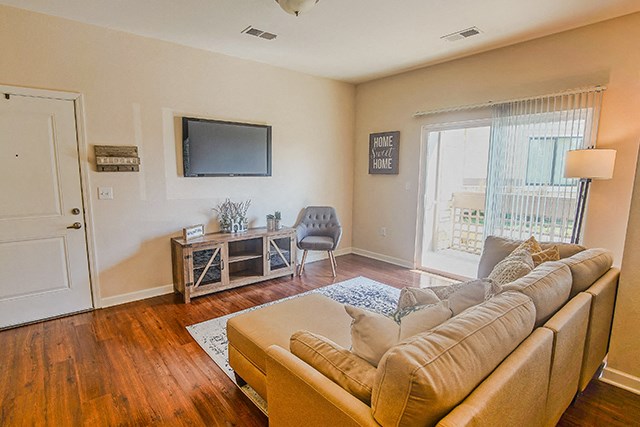 a living room with a couch and a tv