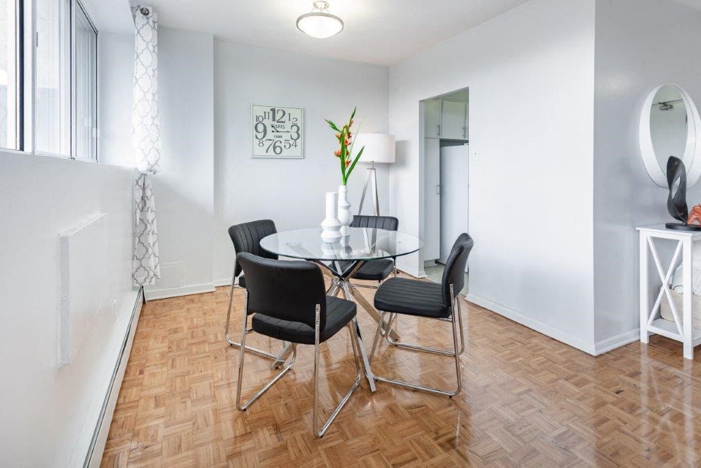 a dining room with a table and chairs