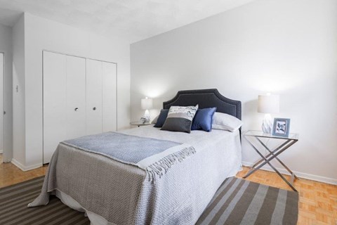 a bedroom with a bed and a closet