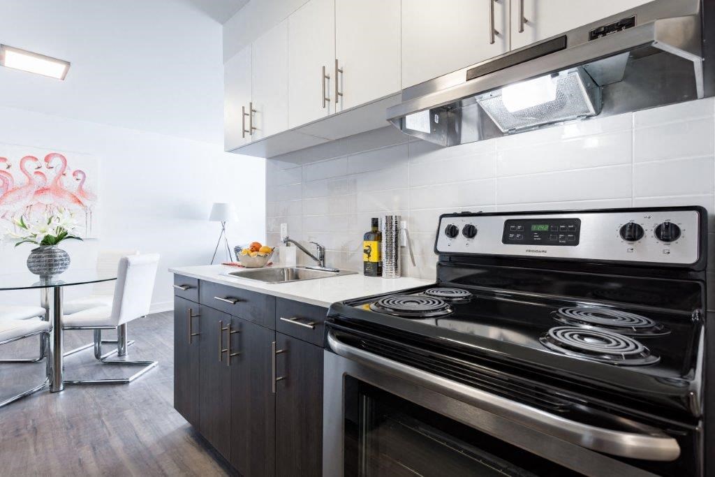 a kitchen with a stove and a sink