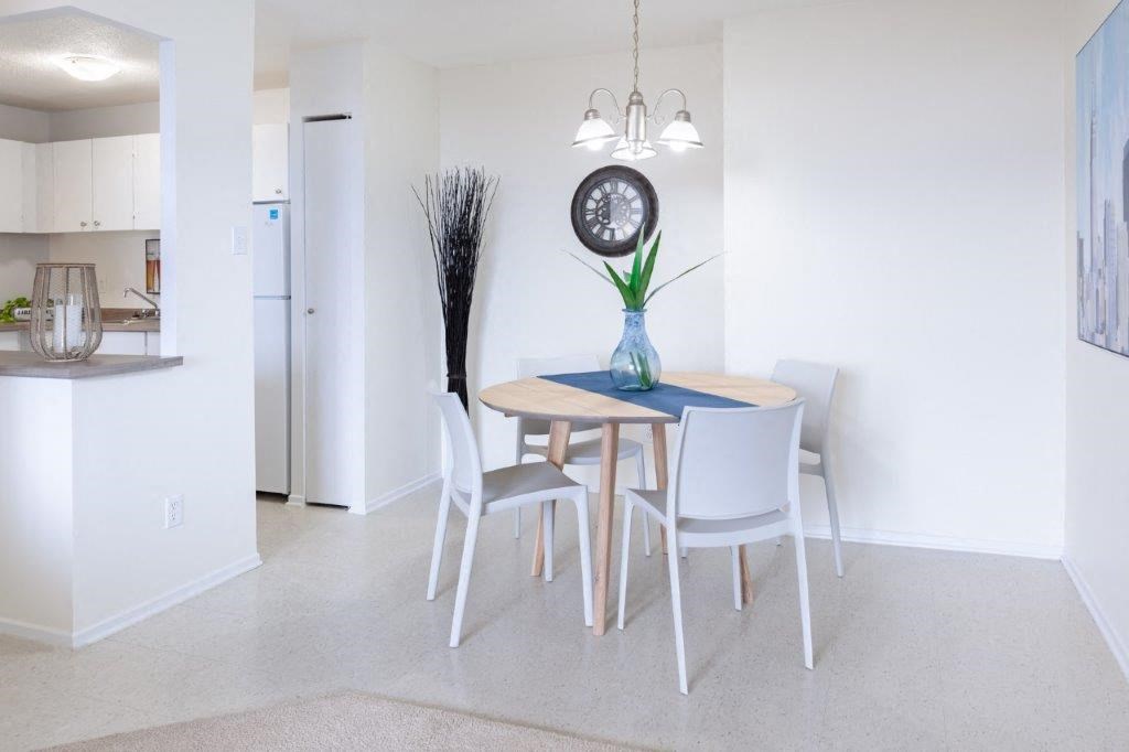 a dining room with a table and chairs