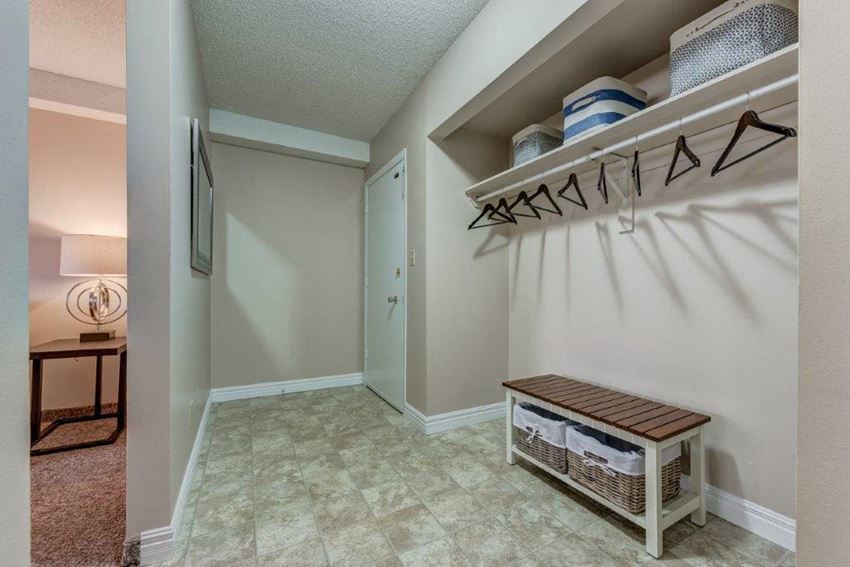 a walk in closet in a bedroom