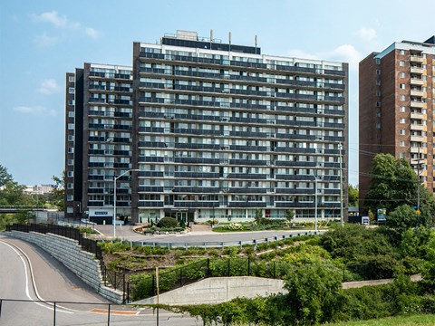 a view of a large building with a highway in front of it