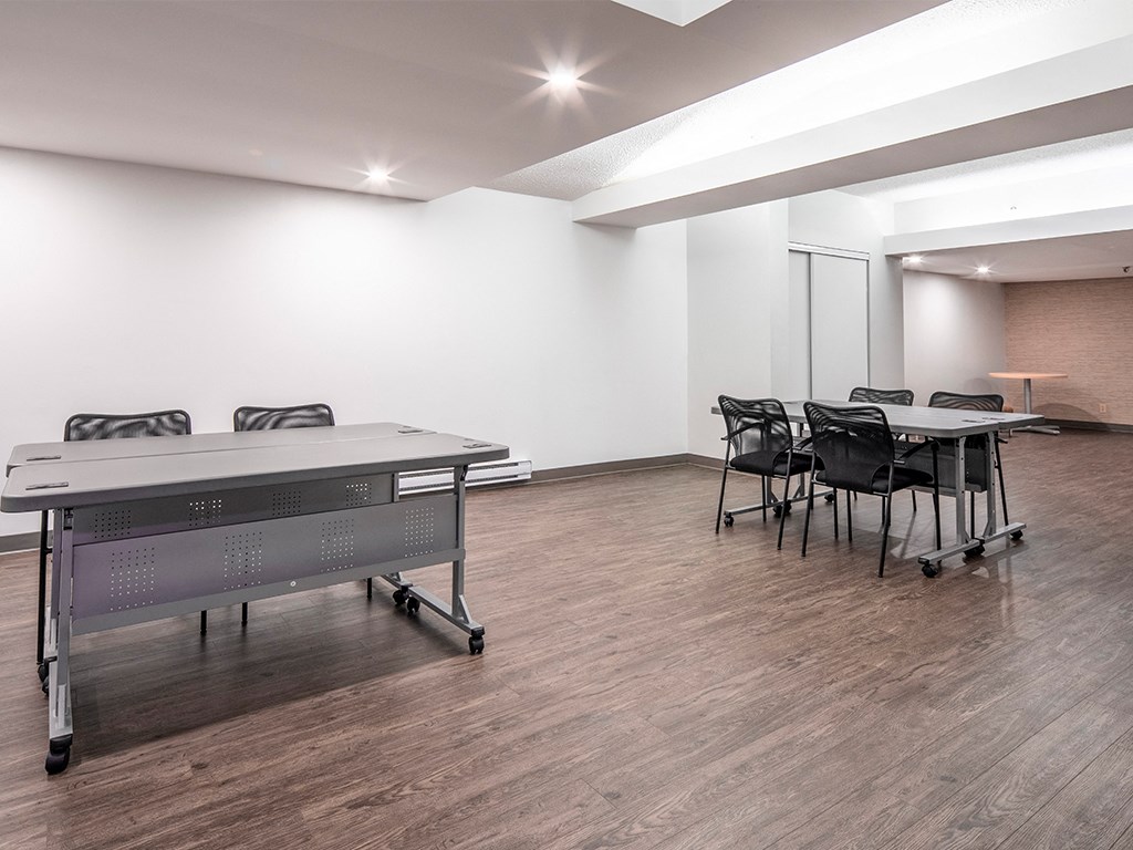 a large room with a ping pong table and a conference room