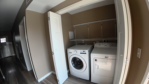 A laundry room with a washer and dryer.
