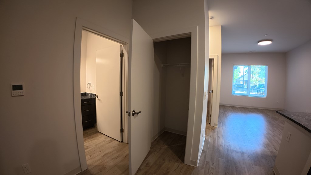 A room with a doorway leading to another room.
