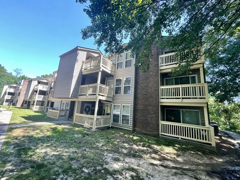 Apartment complex with multiple buildings and balconies.