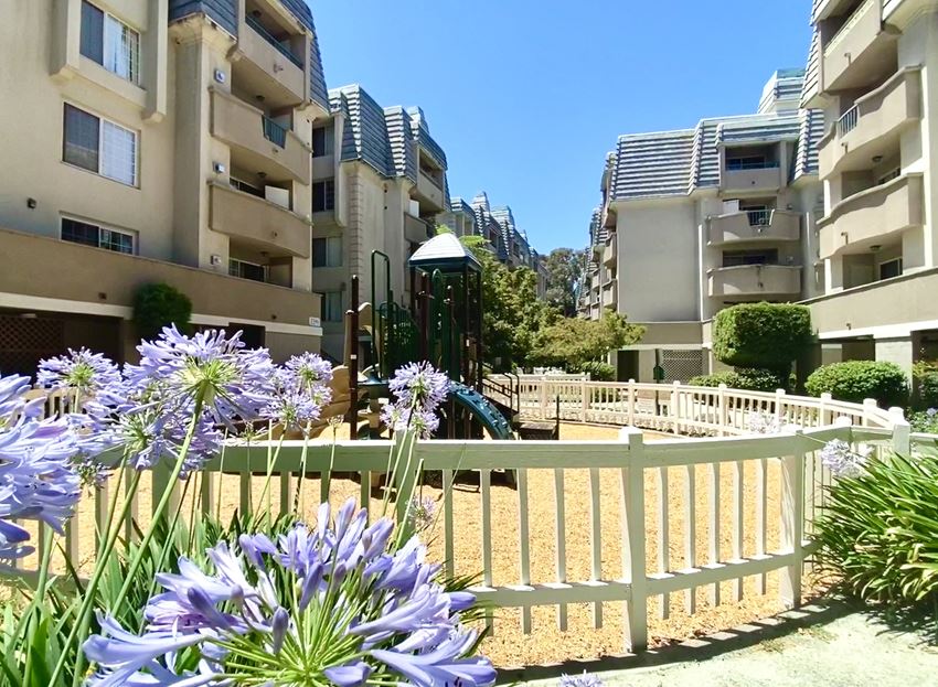 a playground in the middle of an apartment complex