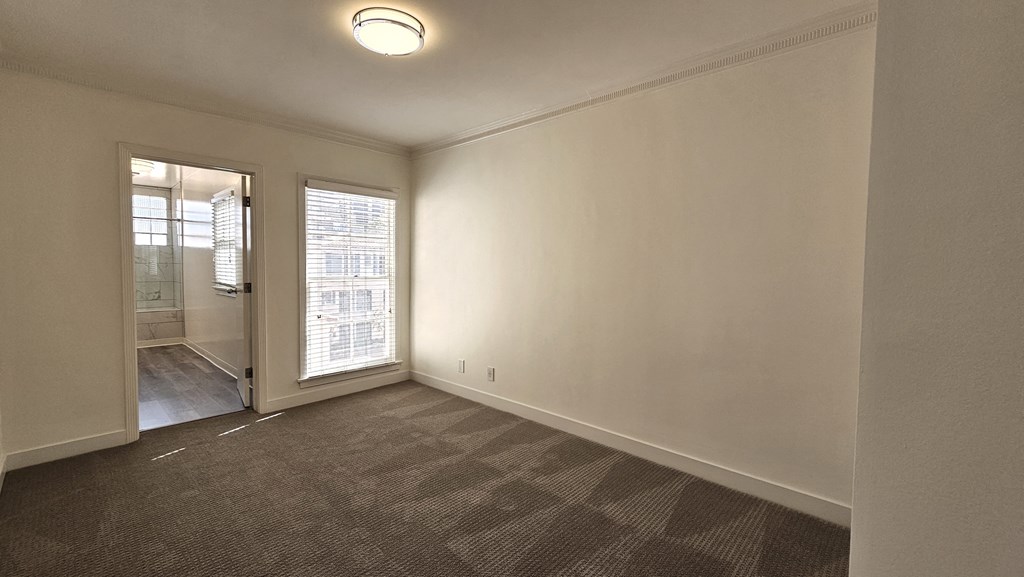 a room with a wall with silhouettes of people on it