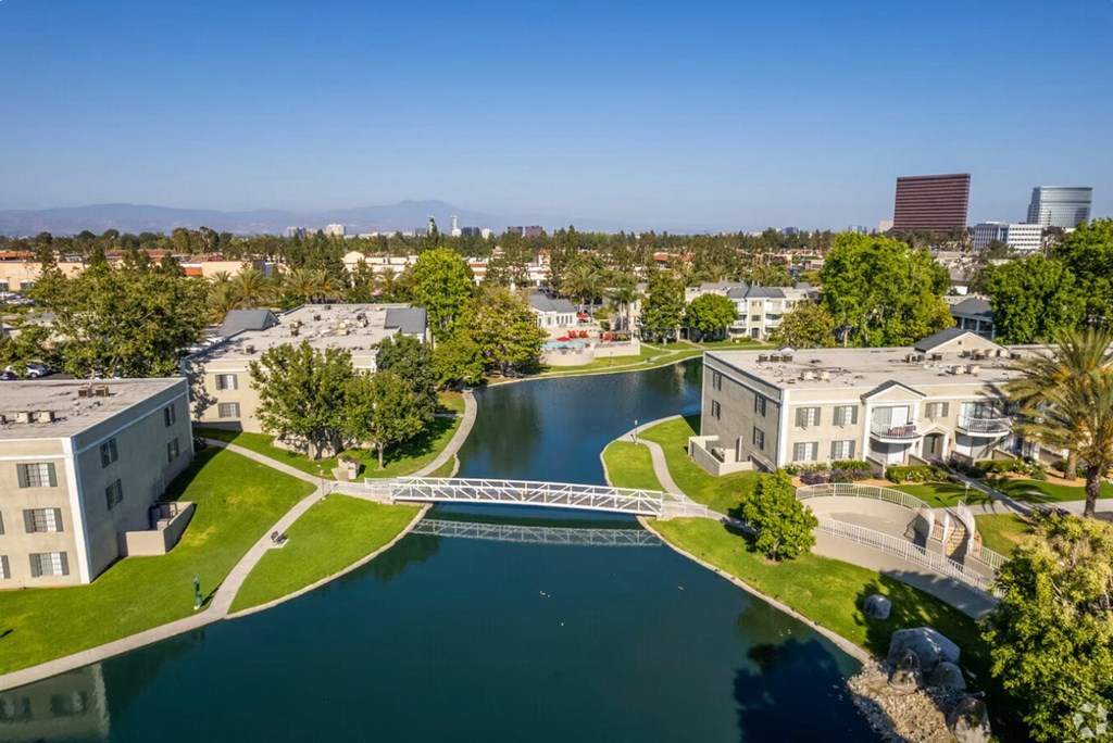 a view of a lake with a bridge in the middle of it
