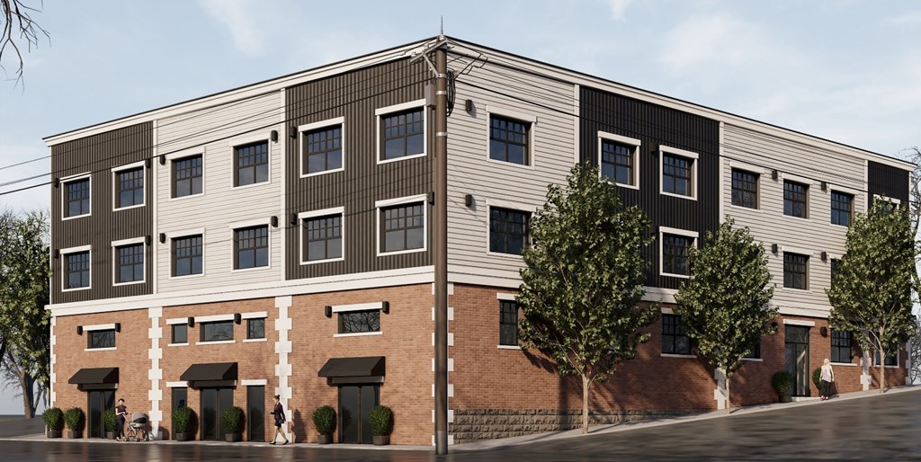 A modern building with a combination of brick and siding exterior.