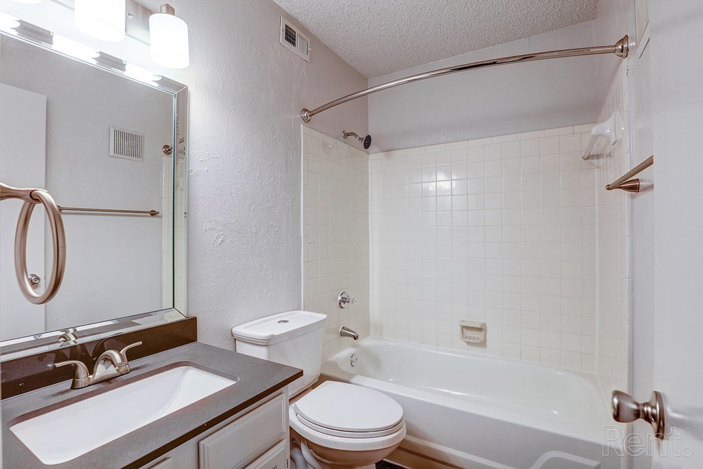 bathroom with framed mirror