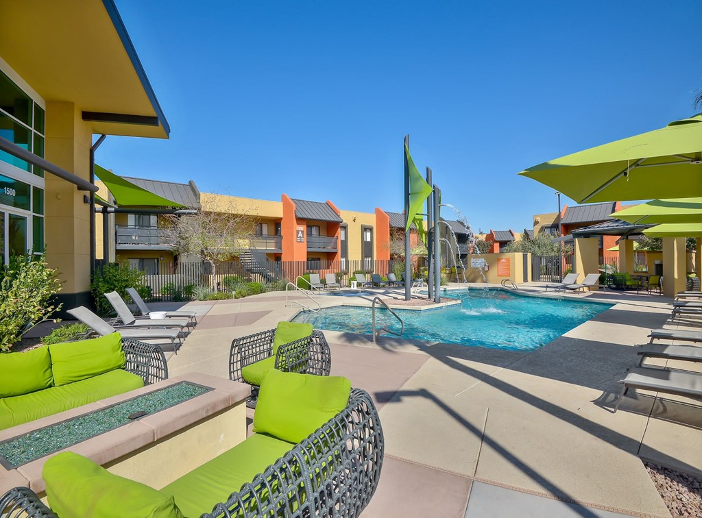 Sparkling resort-style pool and lounging area at Onnix Apartments in Tempe, AZ