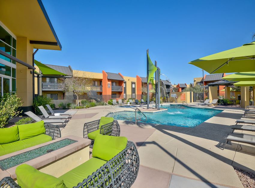 Sparkling resort-style pool and lounging area at Onnix Apartments in Tempe, AZ - Photo Gallery 1