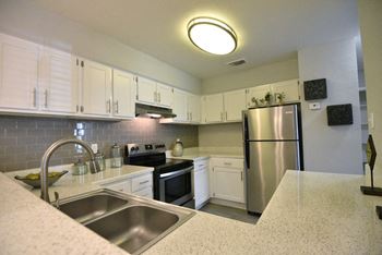 large kitchens with ample storage and all of the upgrades