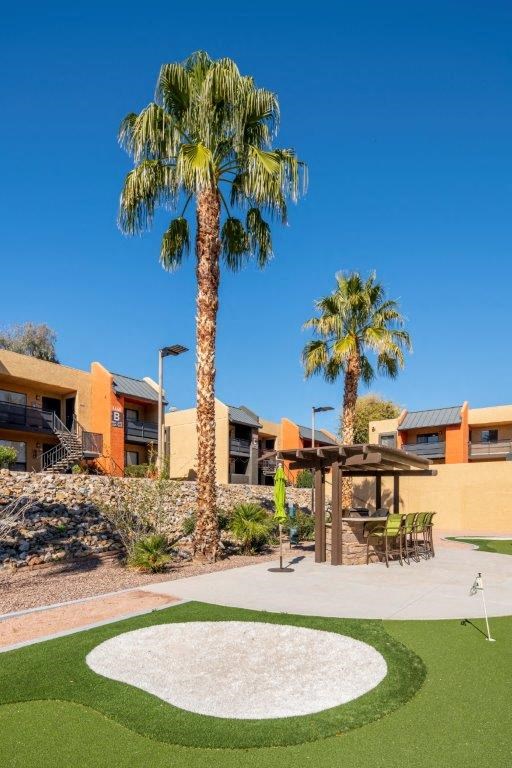 Putting green and outdoor bar featured outside of Onnix Apartments in Tempe, AZ
