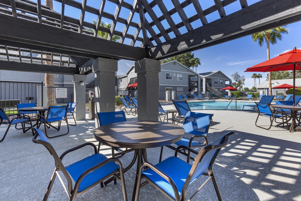 our apartments have a large patio with tables and chairs