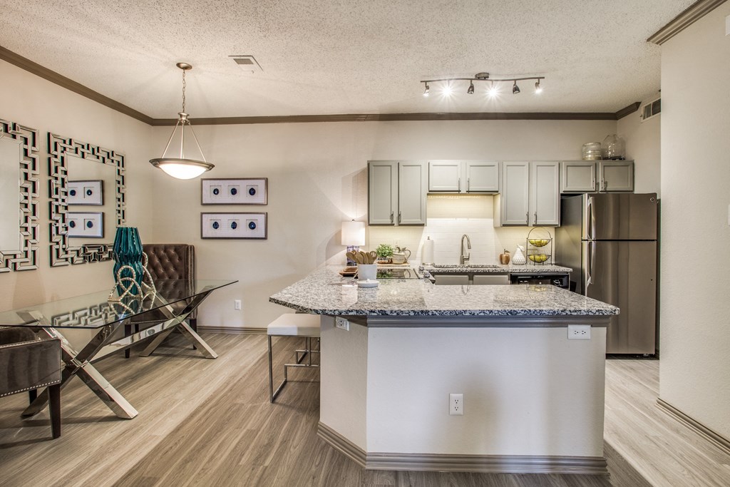 our apartments offer a kitchen and living room with a granite counter top